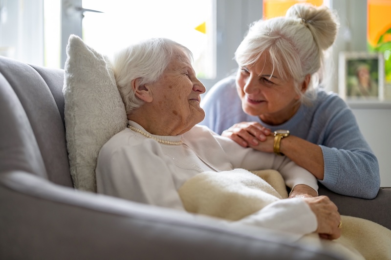 Elderly woman with her caregiver